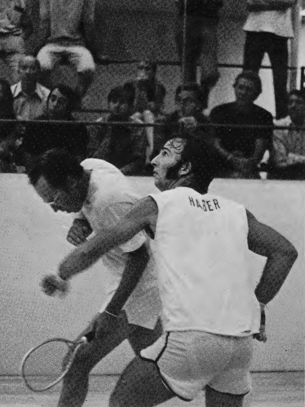 Paul Haber prepares a return as Bud Muehleisen moves clear.